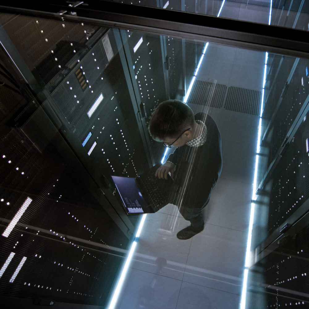 a man working in a server room